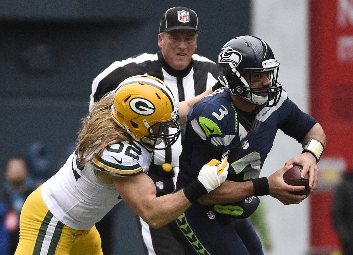 Packers linebacker Clay Matthews attempts to tackle Seahawks quarterback Russell Wilson—Kyle Terada, USA TODAY Sports.